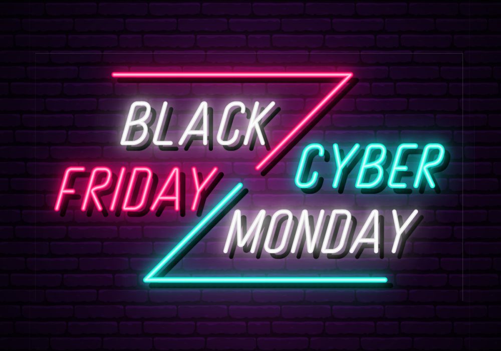 titles with neon lights showing Black Friday vs Cyber Monday