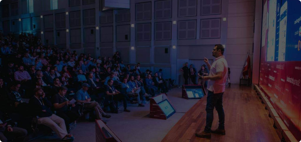 Isidoros Sideridis presenting on a stage